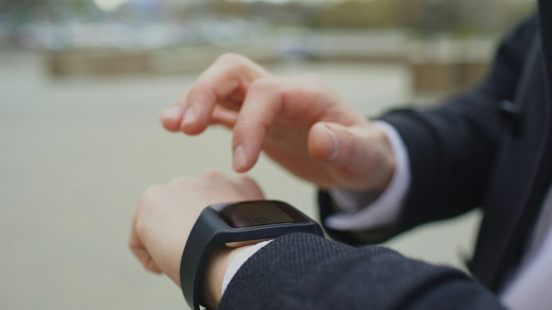 senior using fitness tracker