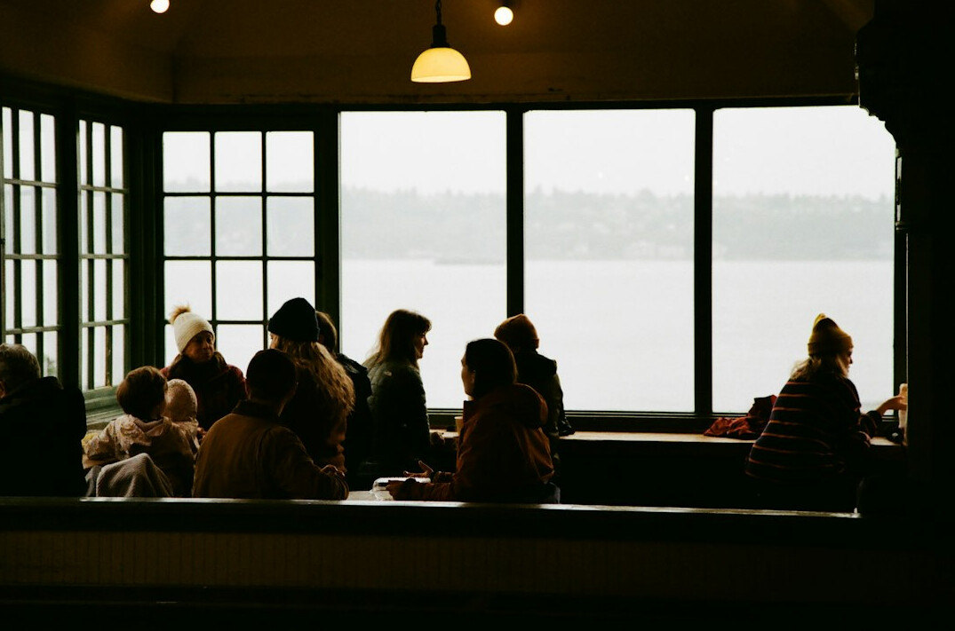 Group of seniors enjoying a community gathering indoors