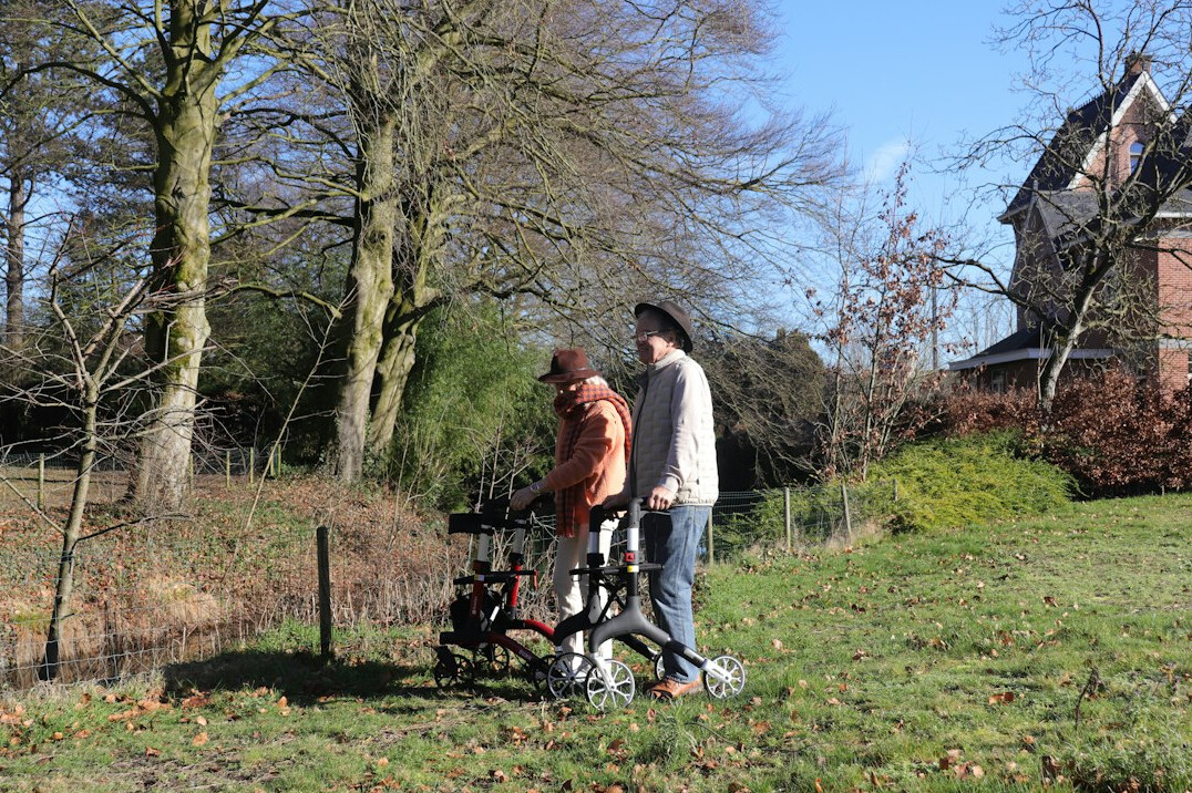 senior couple walking in park