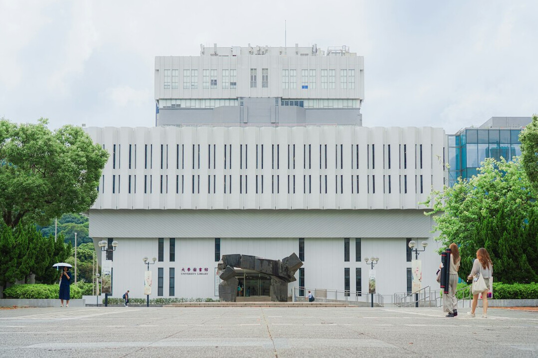 Bright modern community center building entrance with people entering